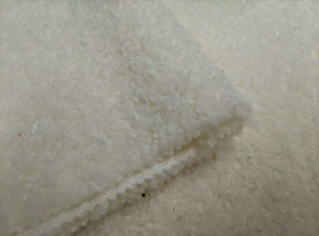 Teddy textured white polyester fabric