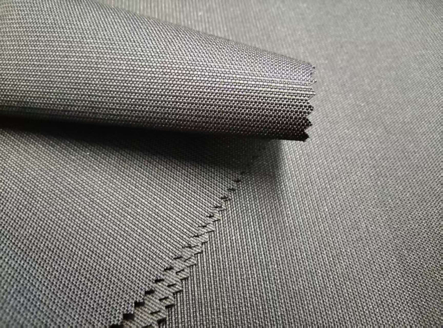 1200D*600D elastic filament dot jacquard polyester fabric