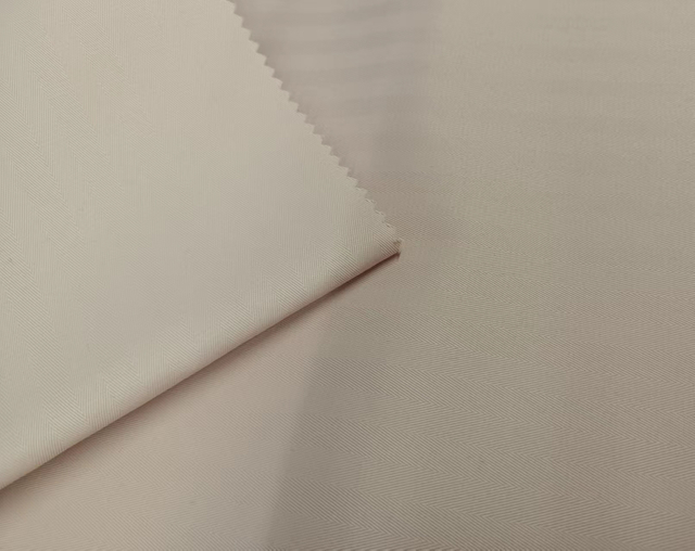 Herringbone dobby with interlock backing polyester fabric