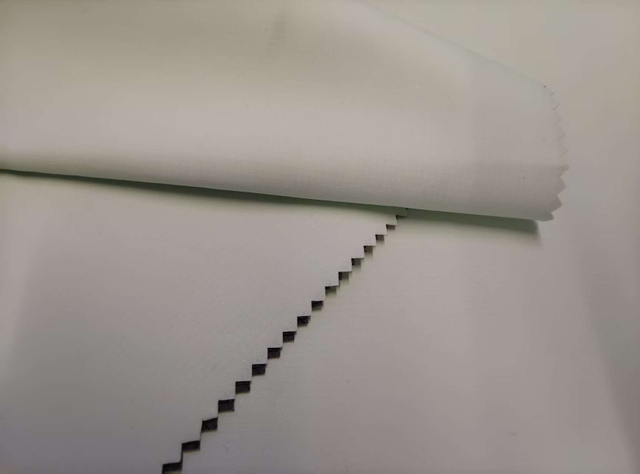 30D full dull double yarn 0.15mm grid Shengtai Green with middle transparent white TPU gray grid floating sand polyester fabric