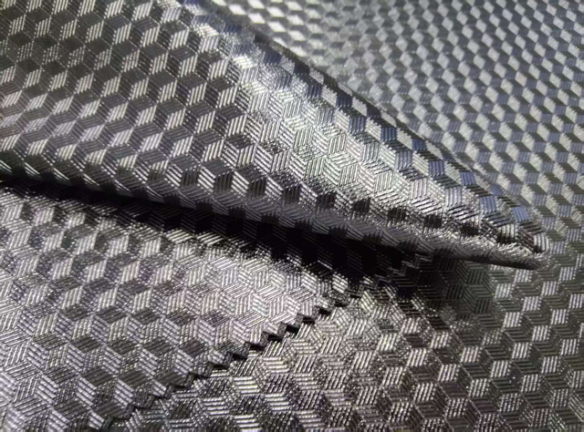 Semi transparent TPU is pasted on 600D fabric, with a 3D embossed pattern and a glossy finish
