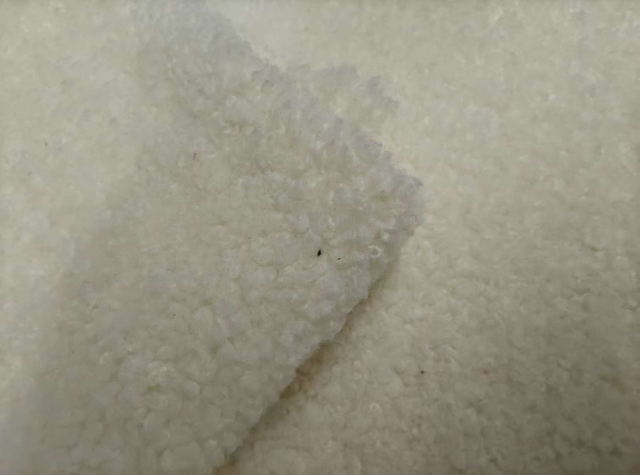 Teddy textured white polyester fabric