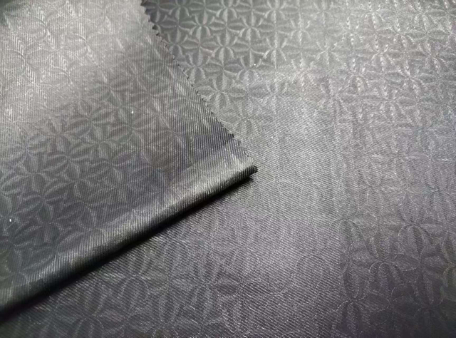 Polyester recycled 3/1 twill embossed fabric