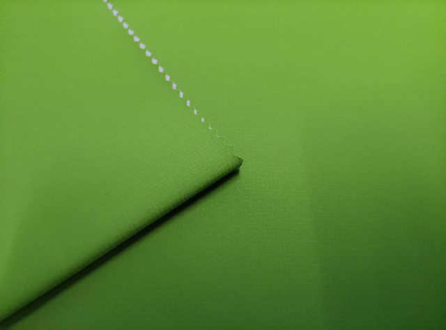 50D Solana 0.15 double-line grid high-transparency film with floating sand effect polyester fabric