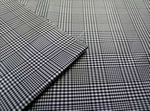 Yarn-dyed black and white large-small check polyester fabric
