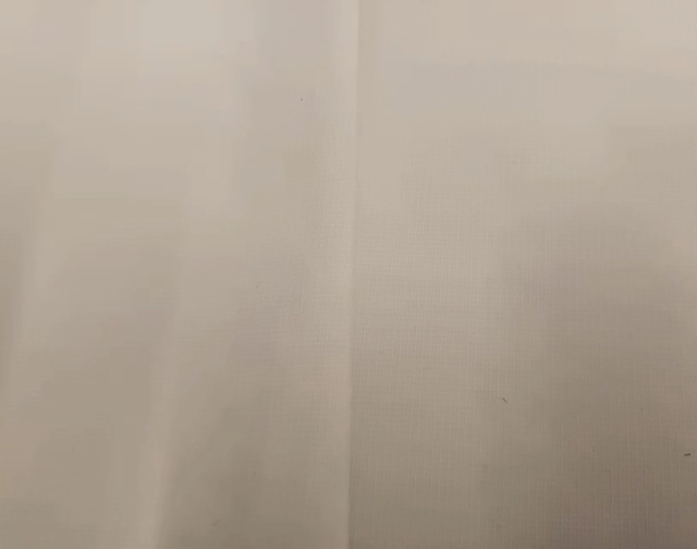 Recycled 200D nylon fabric double line ripstop.