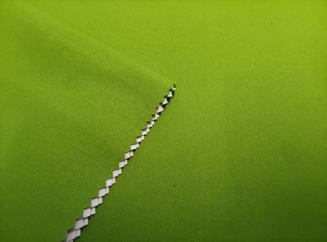 75*150 Warp Twisted Solana with Embossed Dots and White Film Lamination polyester fabric