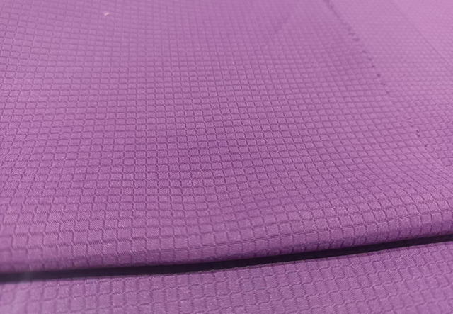 Stretching ripstop weaved polyester fabric