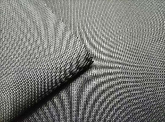 1200D*600D elastic filament dot jacquard polyester fabric