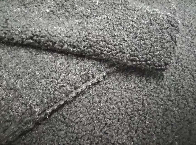 Teddy textured black polyester fabric
