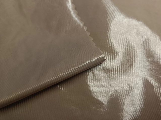 Recycled 70D nylon fabric twill with shiny PU coating on top
