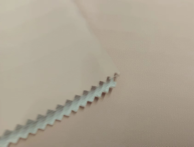 Herringbone dobby with interlock backing polyester fabric