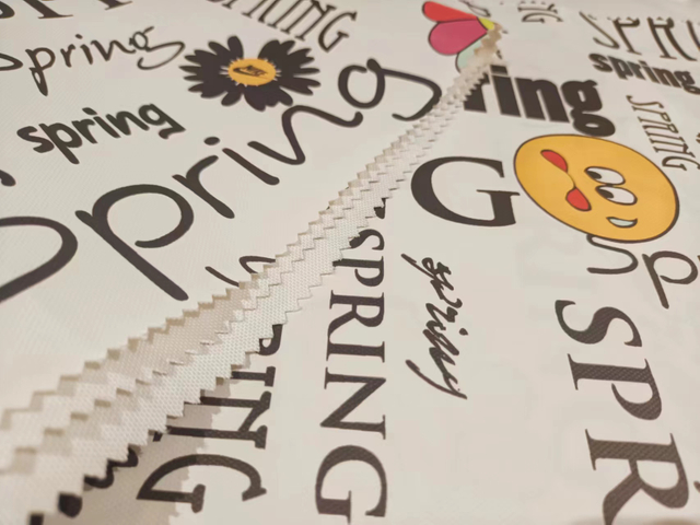 900D stick-off paper printed letter florets polyester fabric