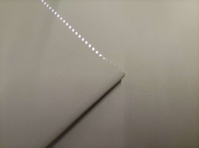 Bio-based Sorona grid semitransparent TPU white film pasted with 20D diamond-shaped KT polyester fabric