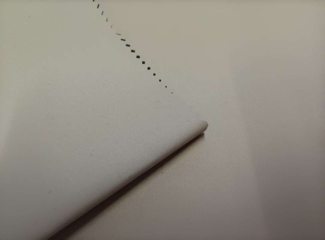 Degradable 75D Twisted Filament 2/2 Twill with White Film Grid and Sand-Drift Effect polyester fabric