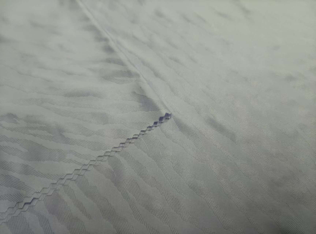 Knitted double sided water splash like jacquard
