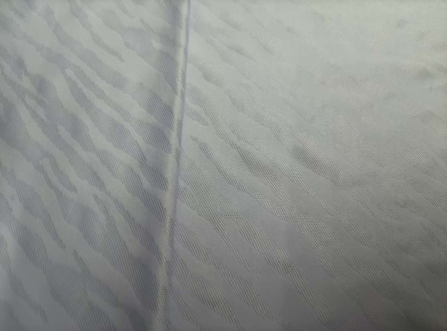 Knitted double sided water splash like jacquard