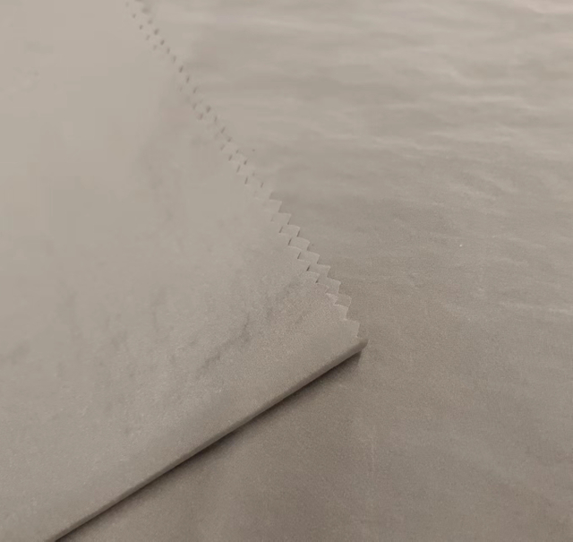 Recycled 380T shiny nylon fabric with dope dyed black yarns