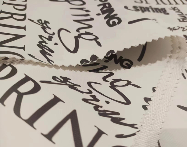 900D stick-off paper printed letter florets polyester fabric